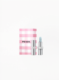 Prada Lip Balm U001 Astral Pink with Limited Edition Prada box, displayed on a clean elegant background featuring authentic Prada Beauty luxury packaging and soft refined pink details.