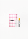 Prada Lip Balm U002 Astral Pink with Limited Edition Prada box, displayed on a clean elegant background featuring authentic Prada Beauty luxury packaging and refined soft pink details.