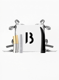 BYREDO beauty gift set featuring Colour Stick Ultramagnetic, Semi-Formal lipstick, and Mascara Eroded Echo and white box with ribbons and B (byredo) logo and white background