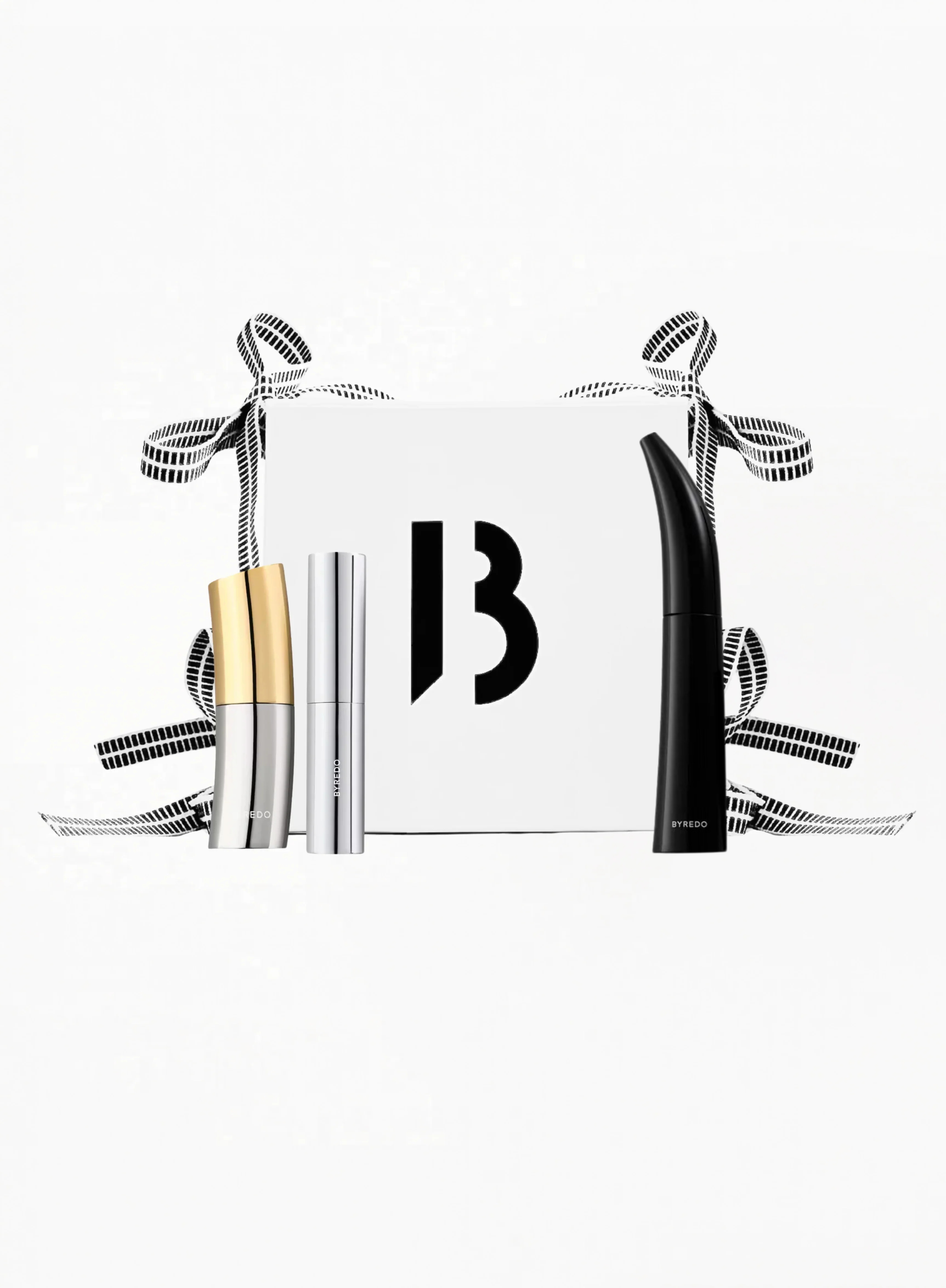 BYREDO beauty gift set featuring Colour Stick Ultramagnetic, Semi-Formal lipstick, and Mascara Eroded Echo and white box with ribbons and B (byredo) logo and white background