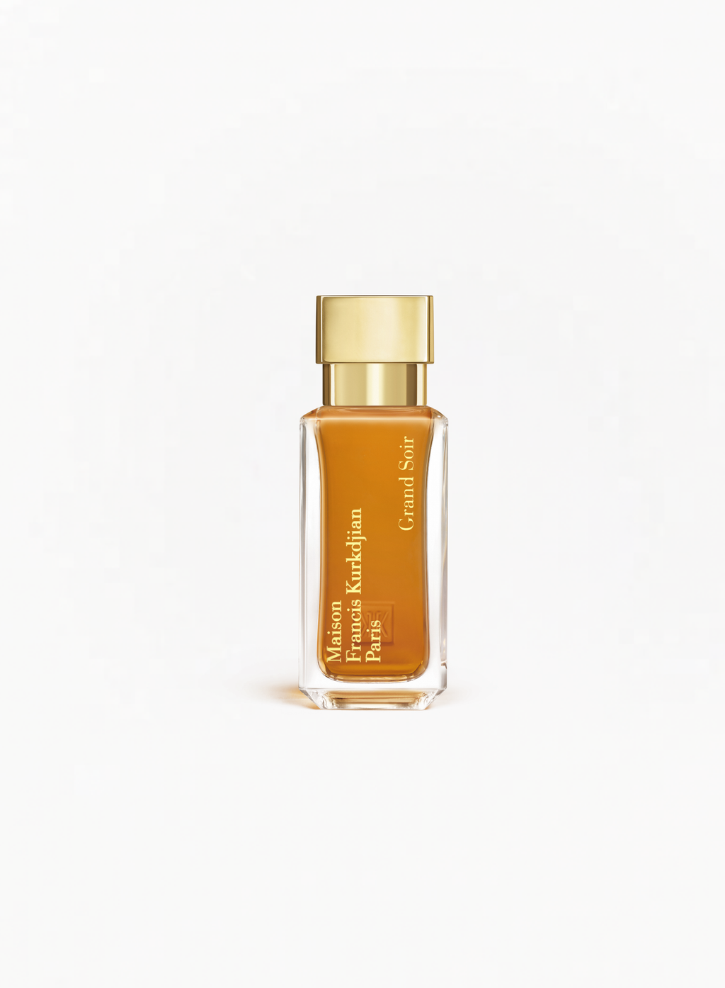 MAISON FRANCIS KURKDJIAN Grand Soir Eau de Parfum 35ml bottle with a gold cap and amber-colored fragrance on a white background.