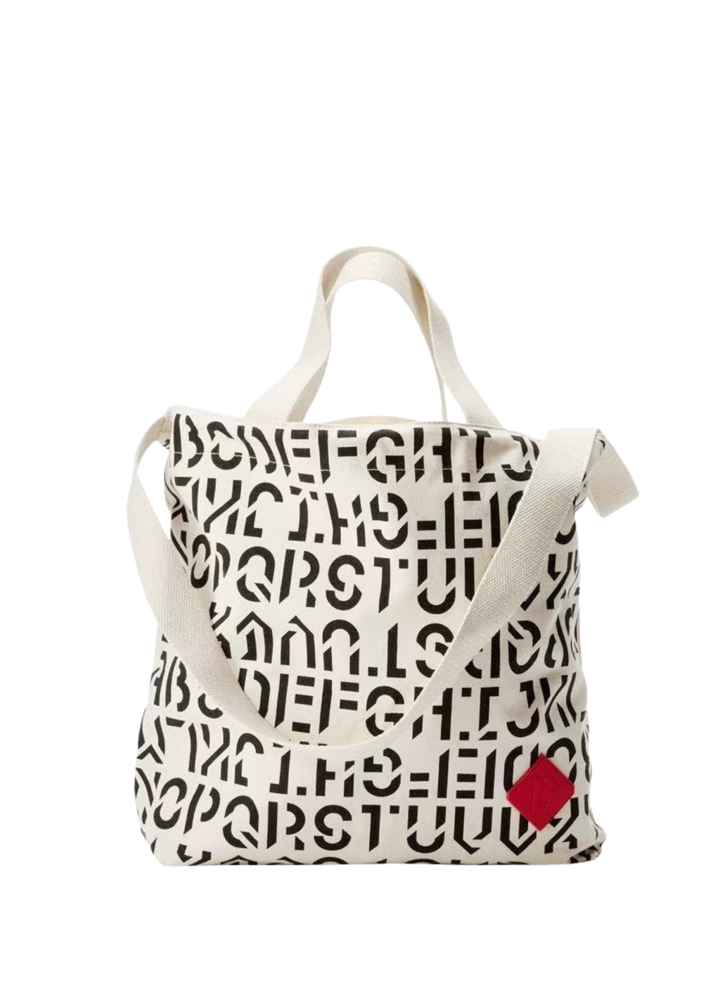 BYREDO 2026 canvas tote bag with black typography pattern and red rubber tag
