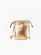 Maison Margiela golden leather-effect tote bag with a metallic finish, black drawstring closure, and a matching gold crossbody strap against a plain white background. The front features the brand's signature numeric logo with the number 3 circled.