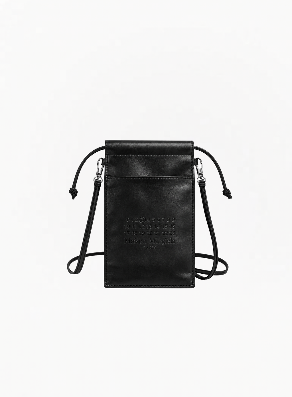 Maison Margiela black leather-effect tote bag featuring a monochromatic design, matching black drawstring closure, and a slim black crossbody strap with silver-tone hardware against a plain white background. The front showcases the brand's signature numeric logo subtly embossed in black, with the number 3 circled.