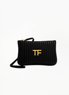 Tom Ford black cosmetics bag with minimalist luxury design and zip closure, photographed on a clean background. Authentic Tom Ford accessory available at Exquisite. 