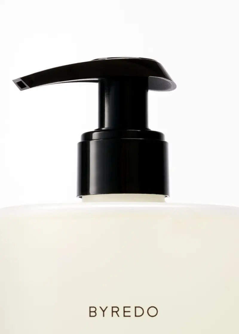 Black pump dispenser on a white background with 'BYREDO' branding.