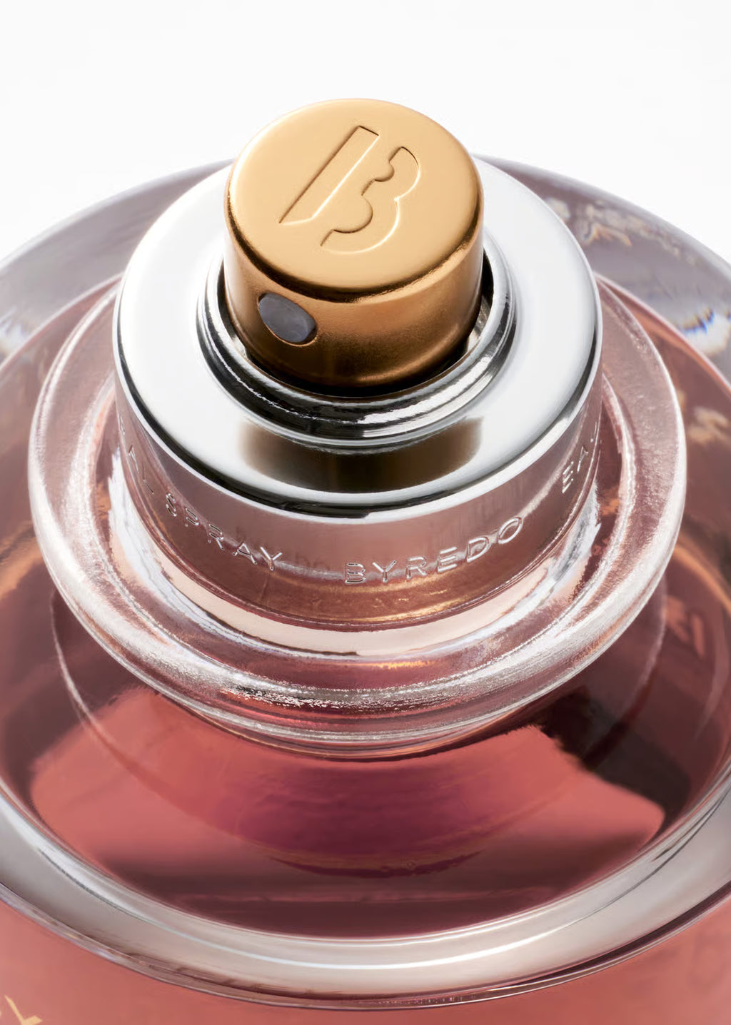 BYREDO Casablanca Lily Close-up of a perfume bottle with a gold cap and visible brand logo.