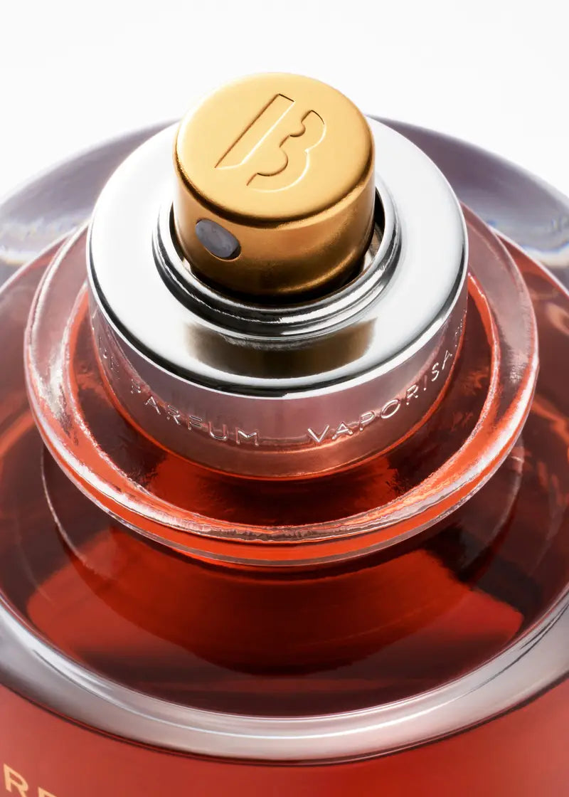 Byredo Rouge Chaotique Extrait de Parfum 70ML Night Veils red bottle with antique gold cap on white background
