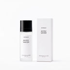 BYREDO Gypsy Water Body Mist in a frosted white bottle with a black cap, displayed alongside its white signature packaging on a clean light background.